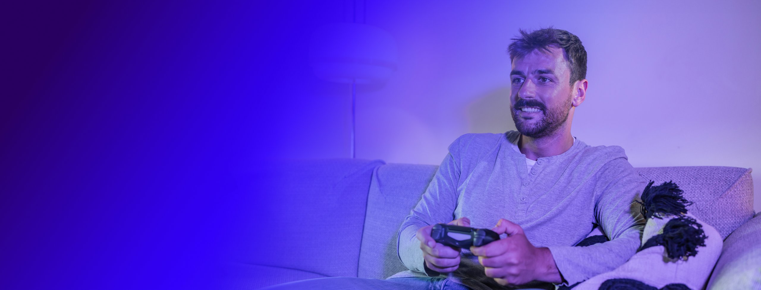 man smiling while gaming