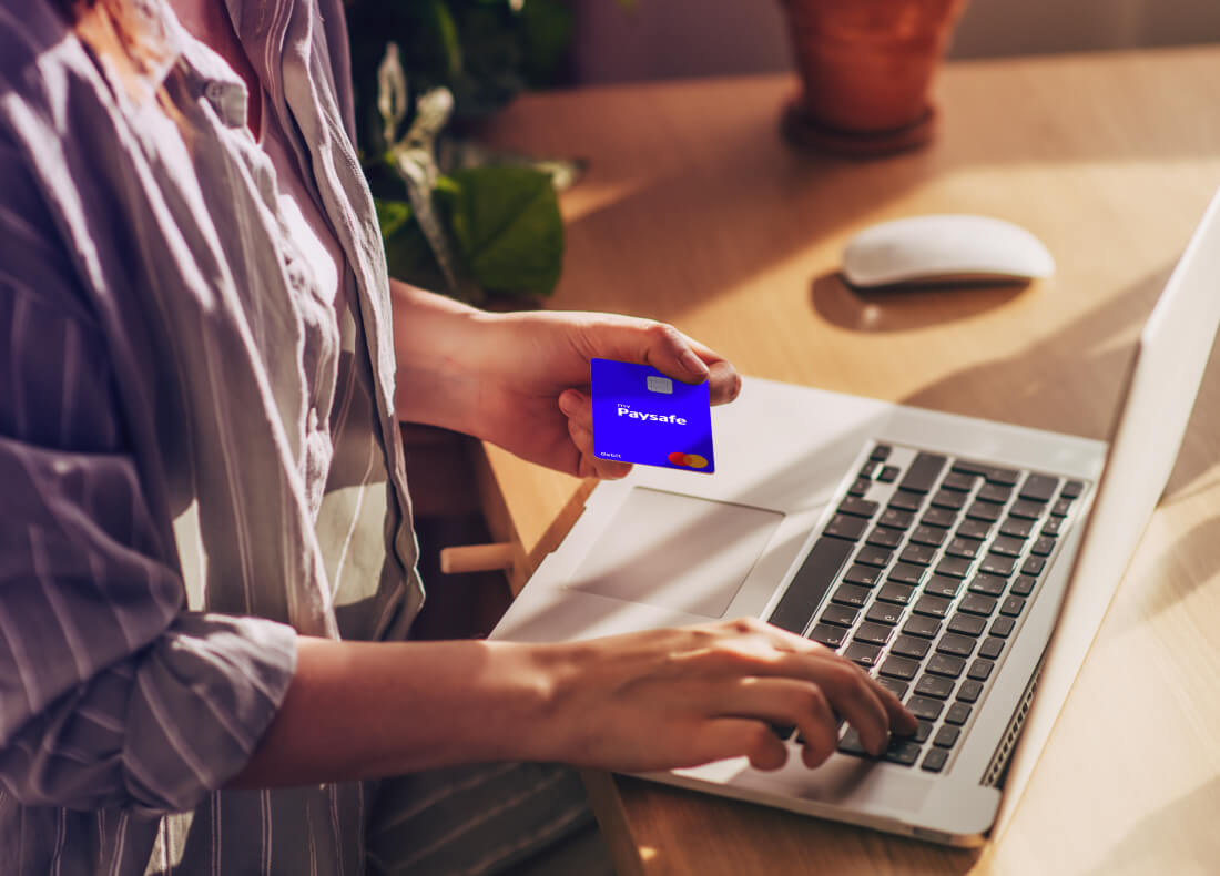 person using their prepaid card and laptop