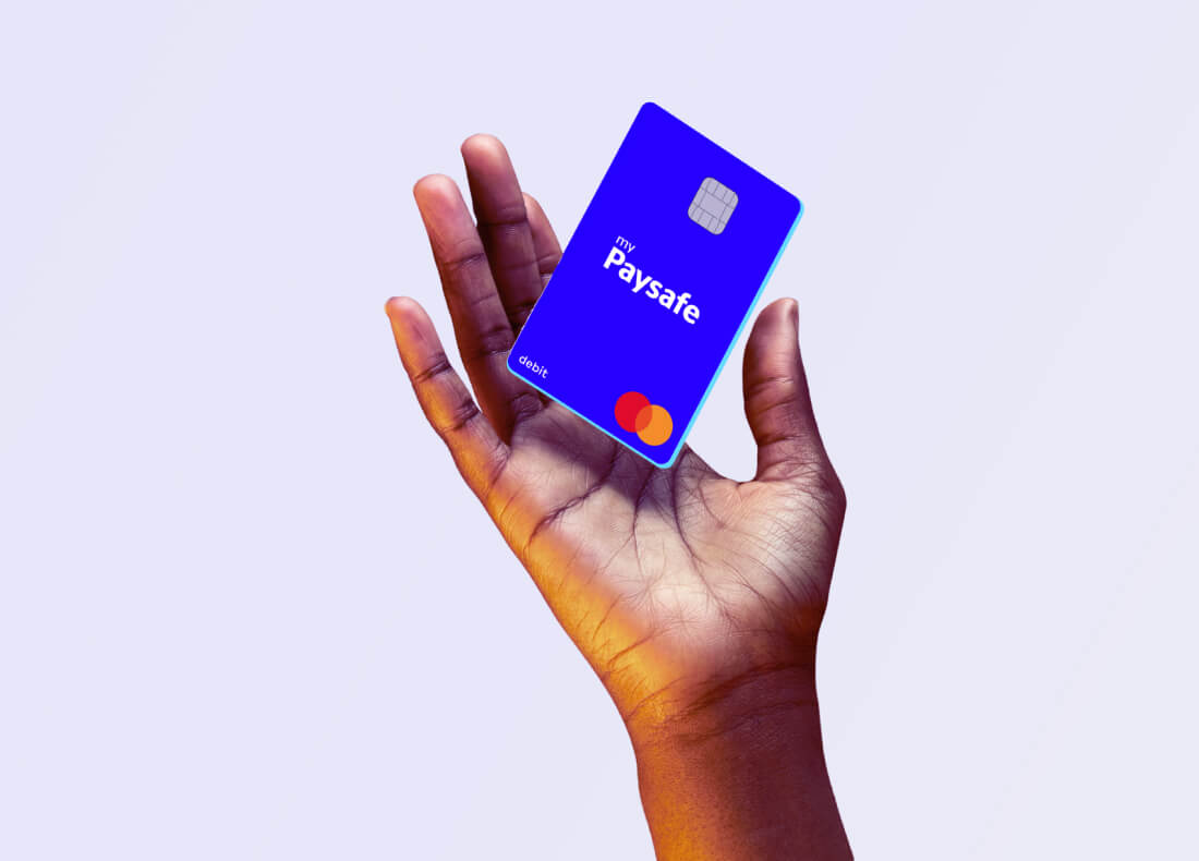 a hand holding a prepaid card