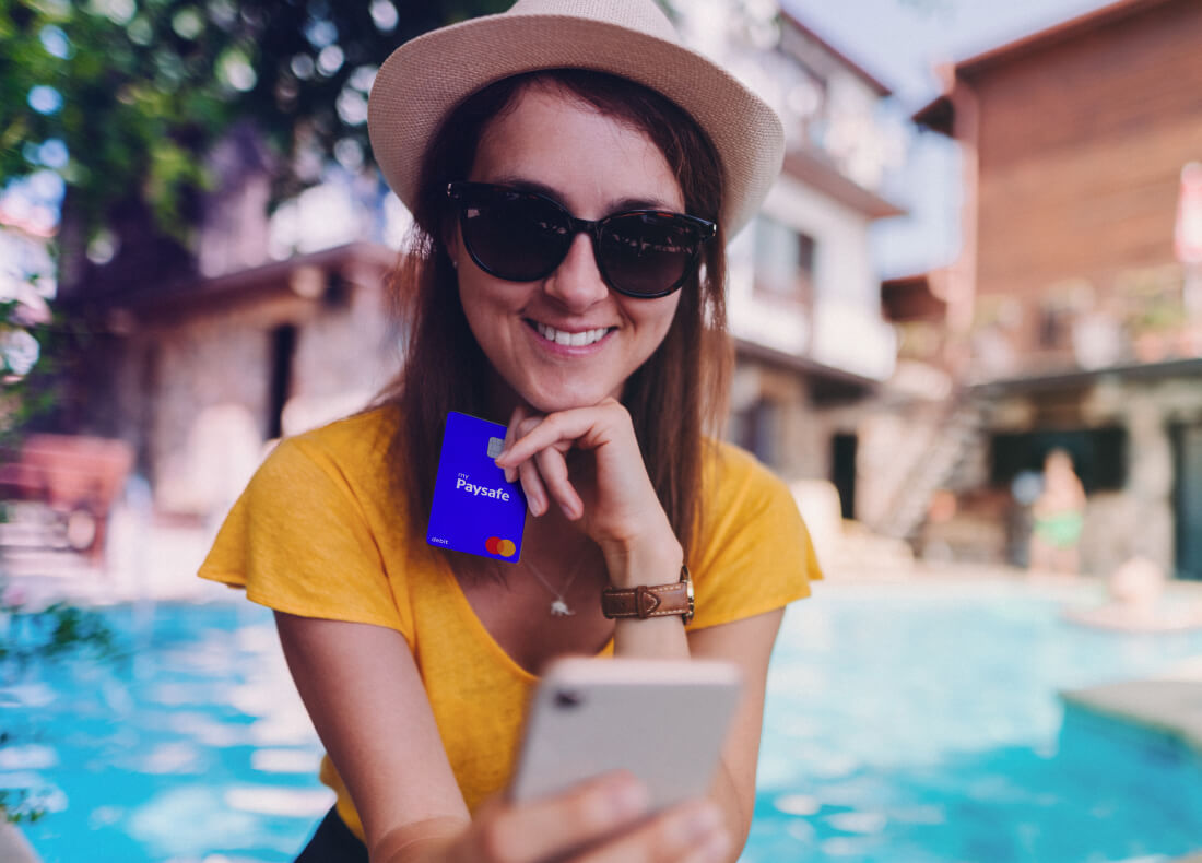girl using a prepaid card and smiling 