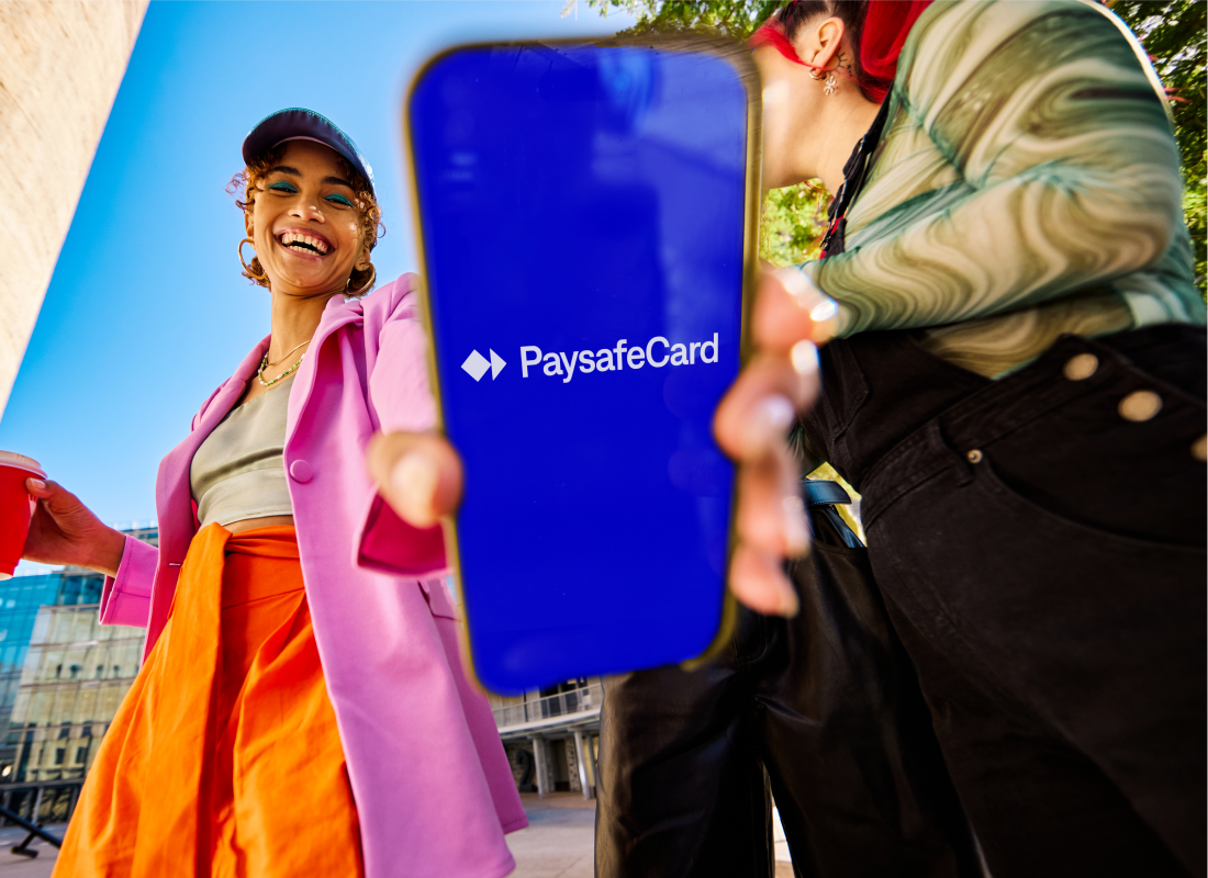 Person showing their Paysafecard app on their smartphone whilst walking on the streets